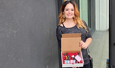 Sarah Springer holds her nail lacquer products.