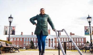 Dr. Wendy Williams stands on top of stairs near Boyden Hall